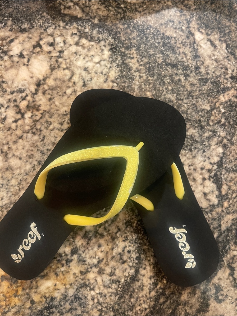 Reef Black Flip Flops with Yellow Glitter Straps